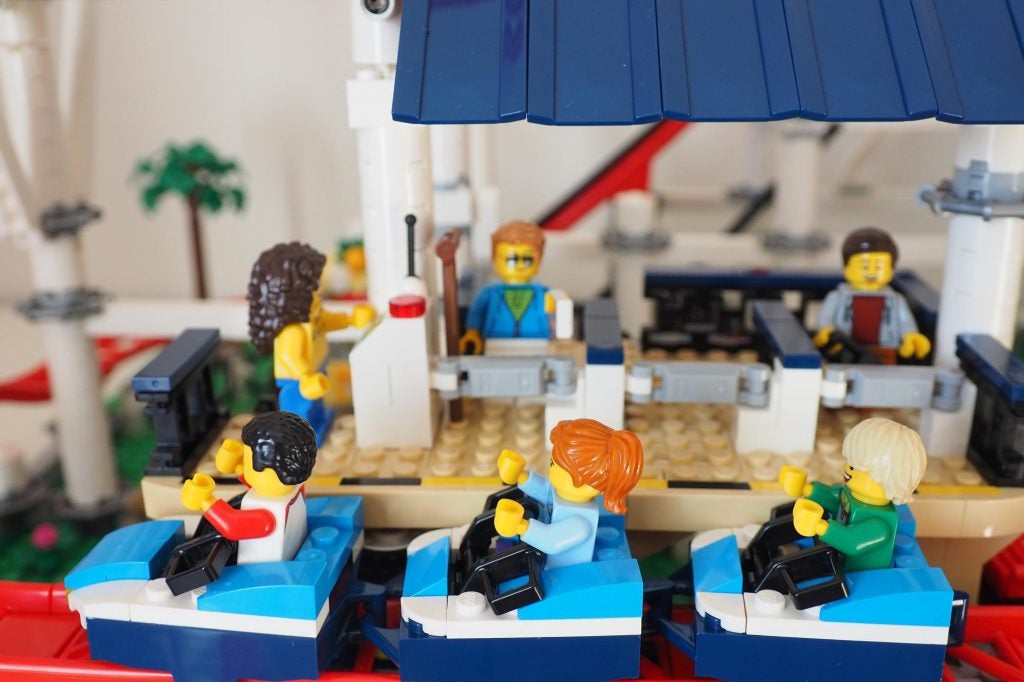 Close up view of roller coaster's station on a Lego set of roller coaster built and kept on floor