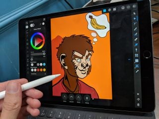 A black iPad standing horizontally, being drawned on via Apple Pencil on Affinity Designer