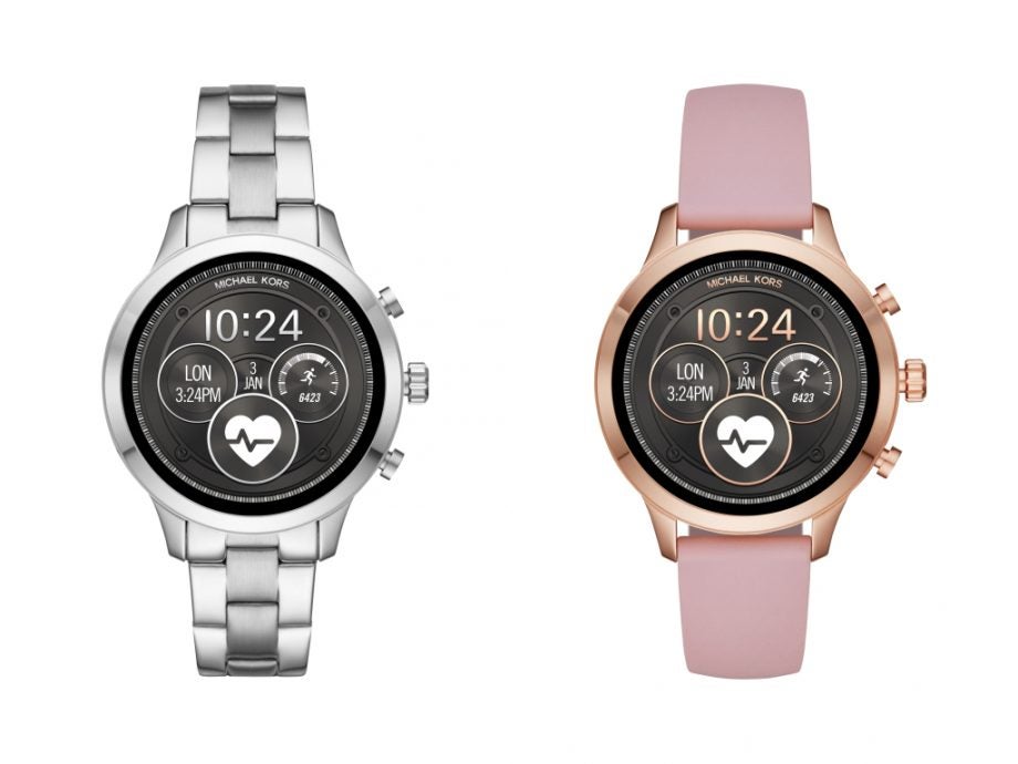 Two different Michael Kors Access Runway smartwatchs standing on white background