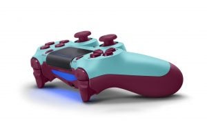 Top back right angled view of a burgundy-blue PS4 Dualshock gaming controller kept on a white background