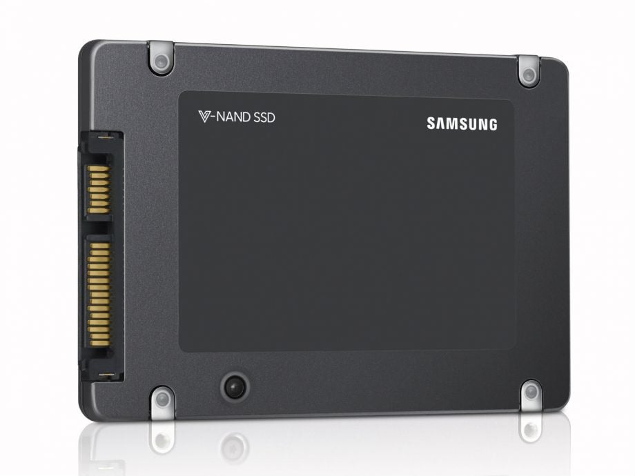 Left angled view of a gray-black Samsung V-Nand 4TB SSD kept on white background