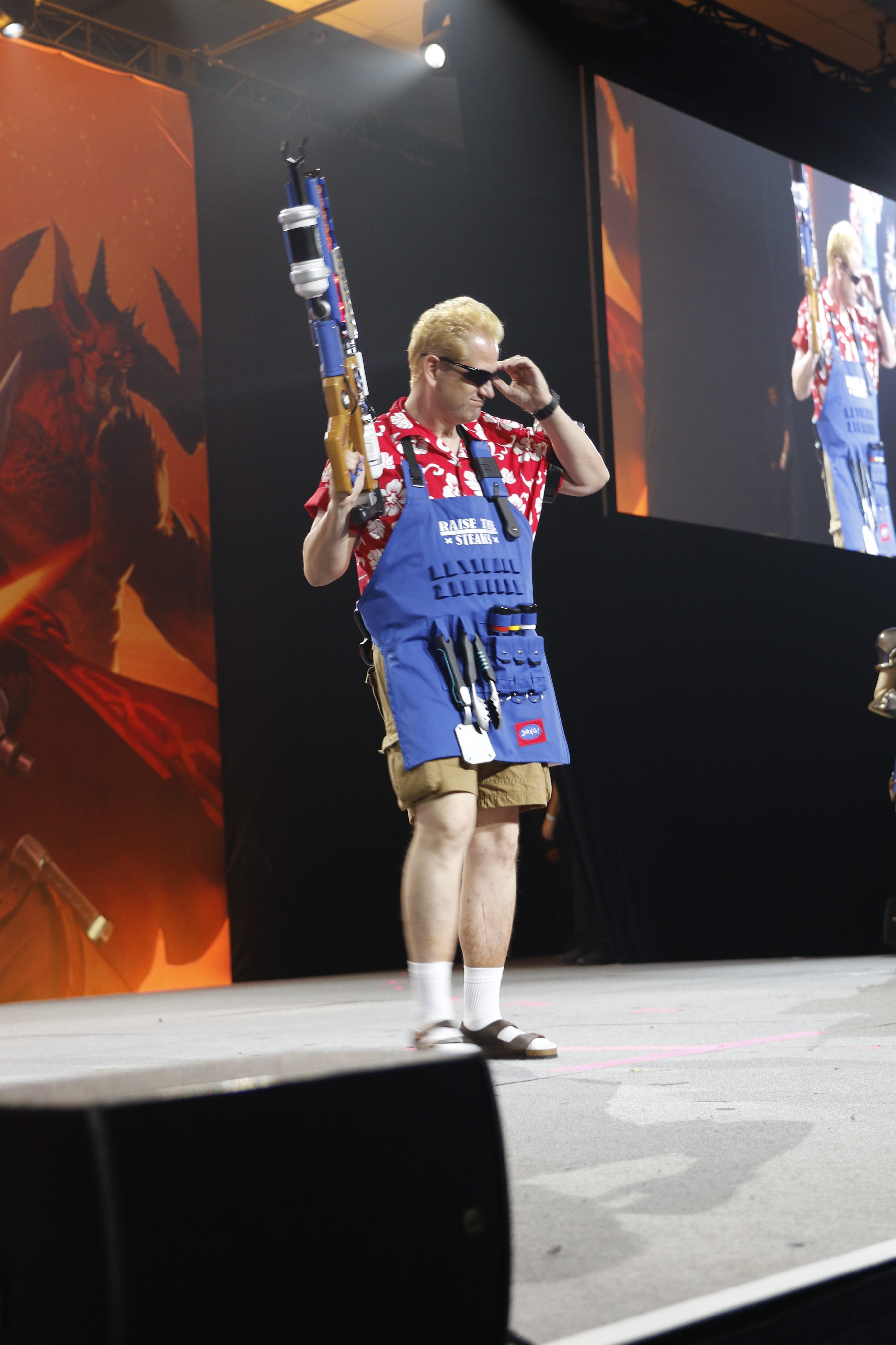 A man dressed as Grillmaster standing on stage