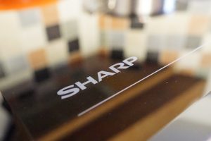 Sharp induction hob close-up with reflective surface.