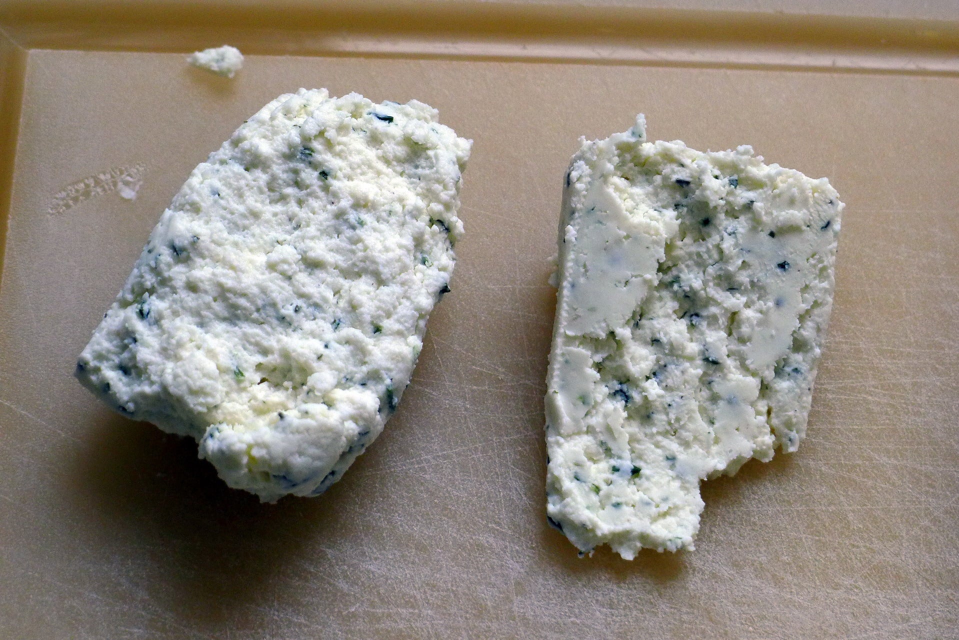Two blocks of Boursin cheese. One previously frozen, one fresh. We couldn't tell the difference