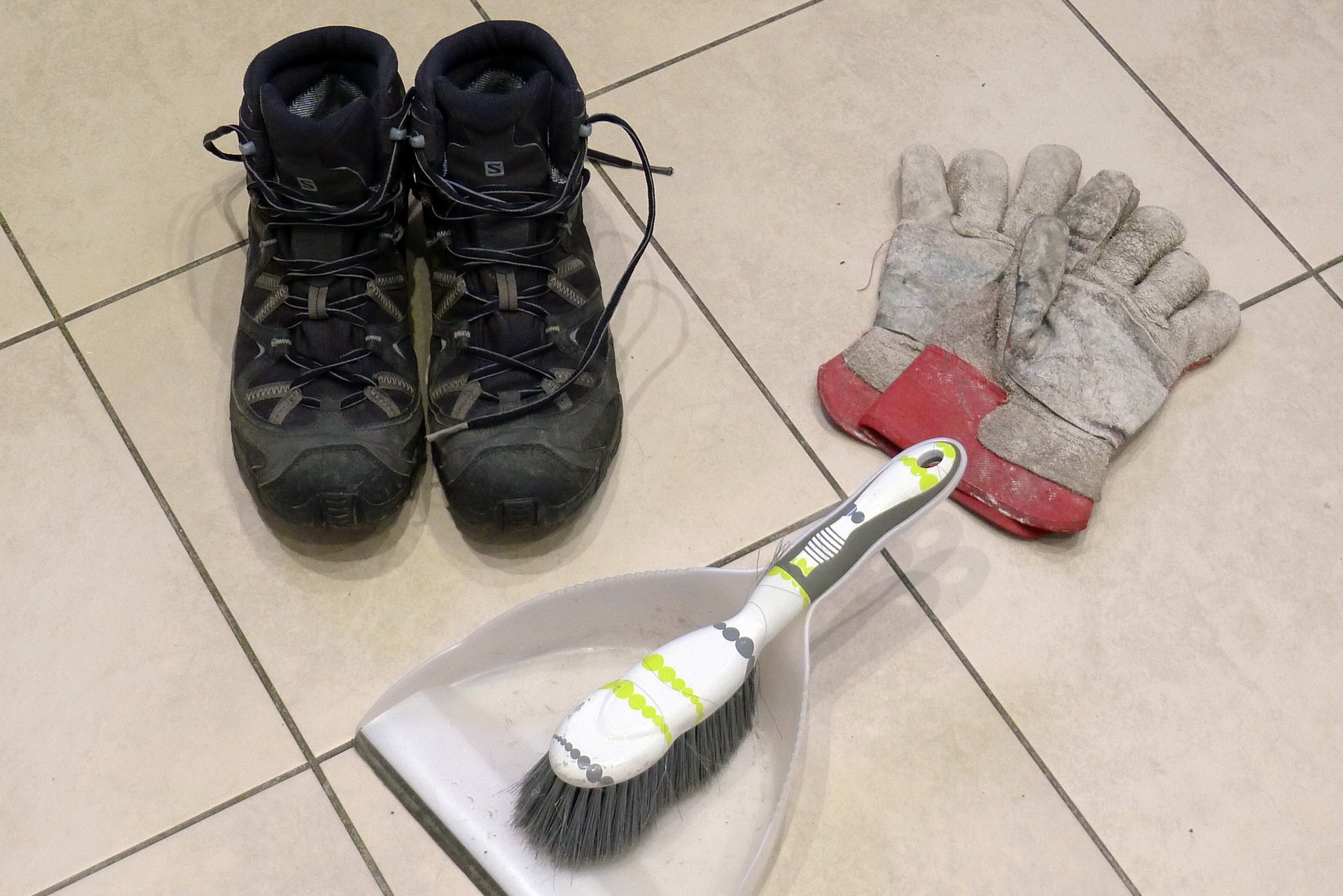 Thick-soled shoes, work gloves and a dustpan and brush