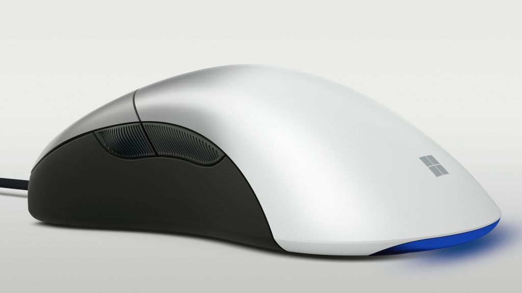 Microsoft Intellimouse ProLeft side edge view of a silver-black Microsoft Pro Intellimouse kept on a silver background