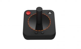 Front-top view of a black Atari VCS joystick kept on a white background