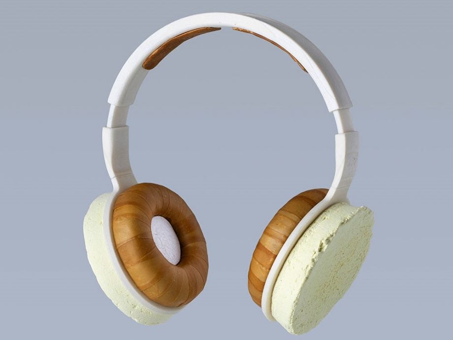 White Korvaa headphones floating on a blue background
