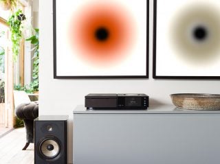 A black Naim Star Uniti kept on a table in a living room