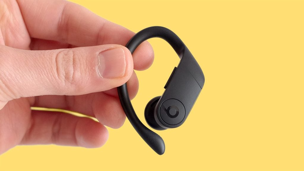Powerbeats ProClose up view of a black Powerbeats earbud held in hand