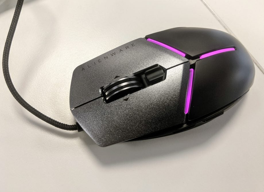 View from top of a black Alienware mouse kept on a white table