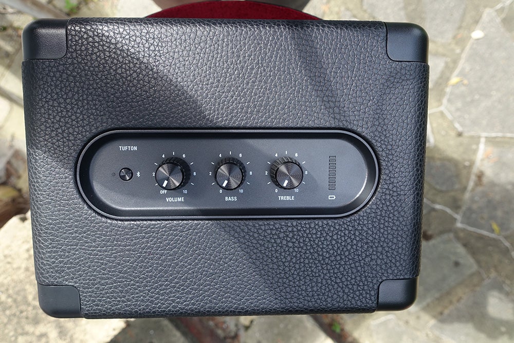 Marshall TuftonTop edge view of a black Marshall Tufton speaker with buttons on it