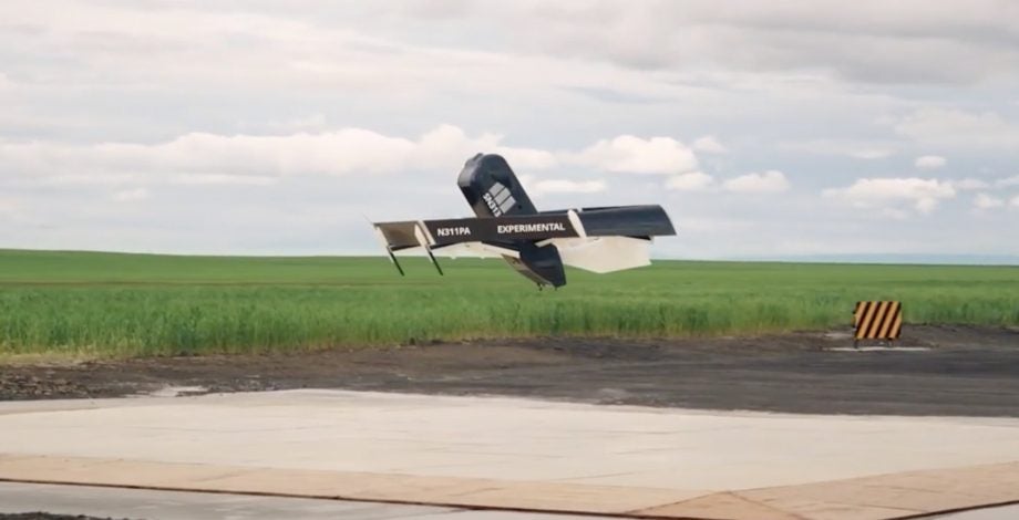 A black new Amazon's delivery drone taking off