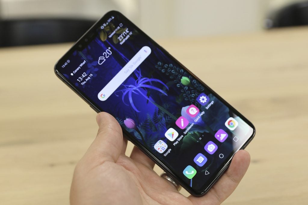 LG V50 front angled in hand on table