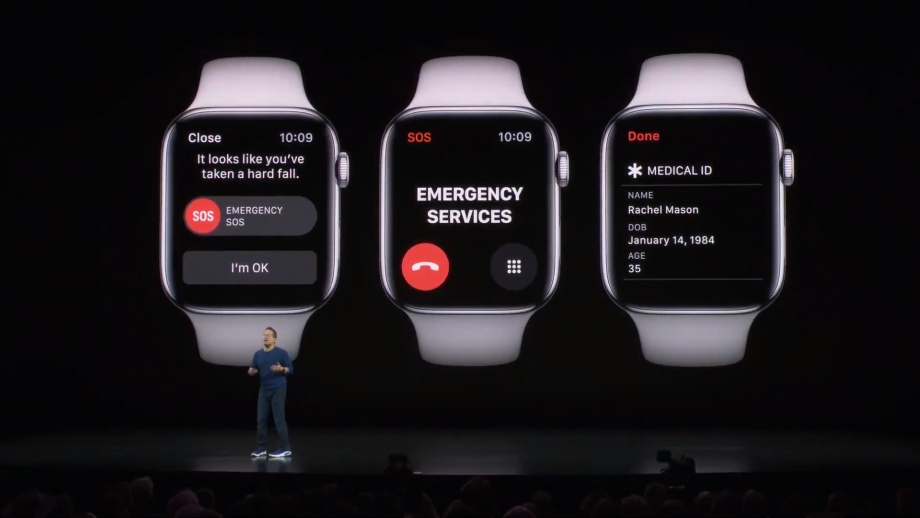 A man standing on stage with Apple Watch series 5's SOS, emergency calling and medical ID displayed on the screen behind