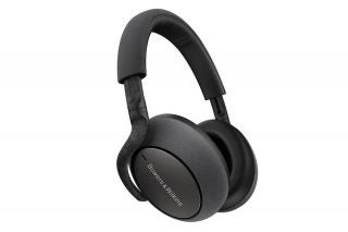 A picture of black BW PX7 headphones floating on a white background