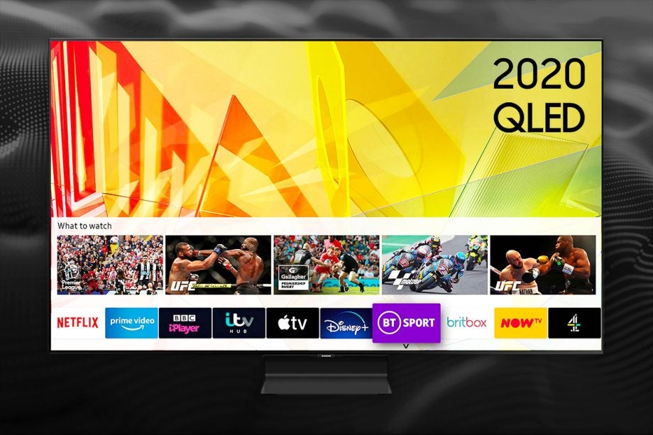 A gray 2020 QLED TV standing on a black background displaying homescreen