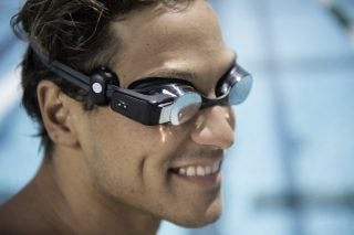 A man wearing Form Swim Goggles Polar OH1