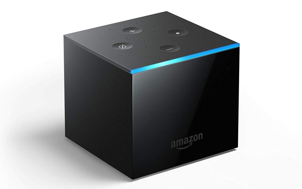 Left angled view of a black Fire TV Cube kept on a white background