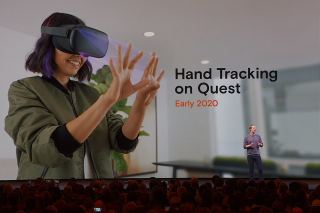 A man standing on stage in front of crowd with hand tracking on Oculus Quest VR displayed on screen behind