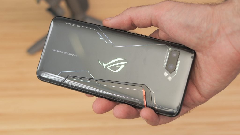 Back panel view of a black Asus ROG Phone 2 held in hand facing down