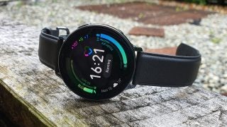 A black Samsung Galaxy Watch Active 2 laid on a table displaying heart details