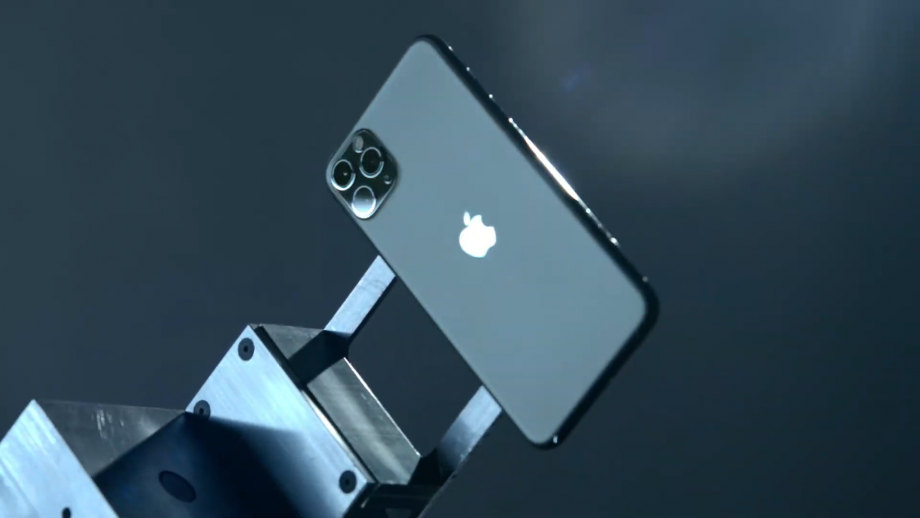 Right angled view of a black iPhone 11 sticked to a metal hand