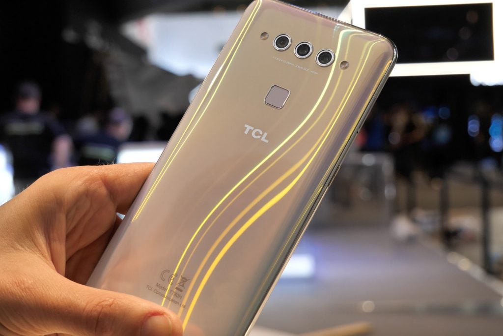 Back panel view of a TCL plex smartphone held in hand facing back