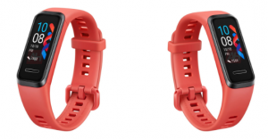 Two orange-pink Huawei Fitness trackers standing on white background