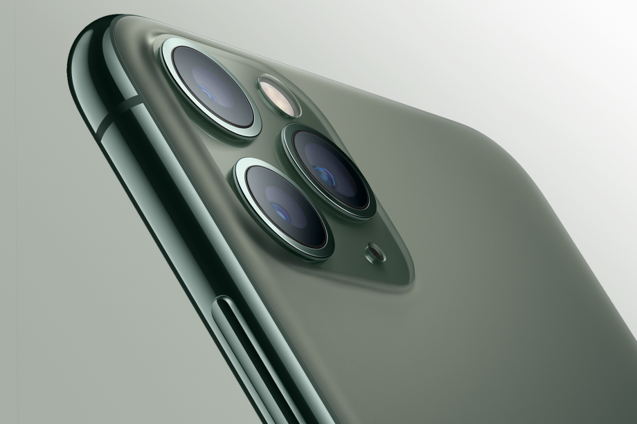 Top half left angled view of a dark green iPhone 11 Pro
