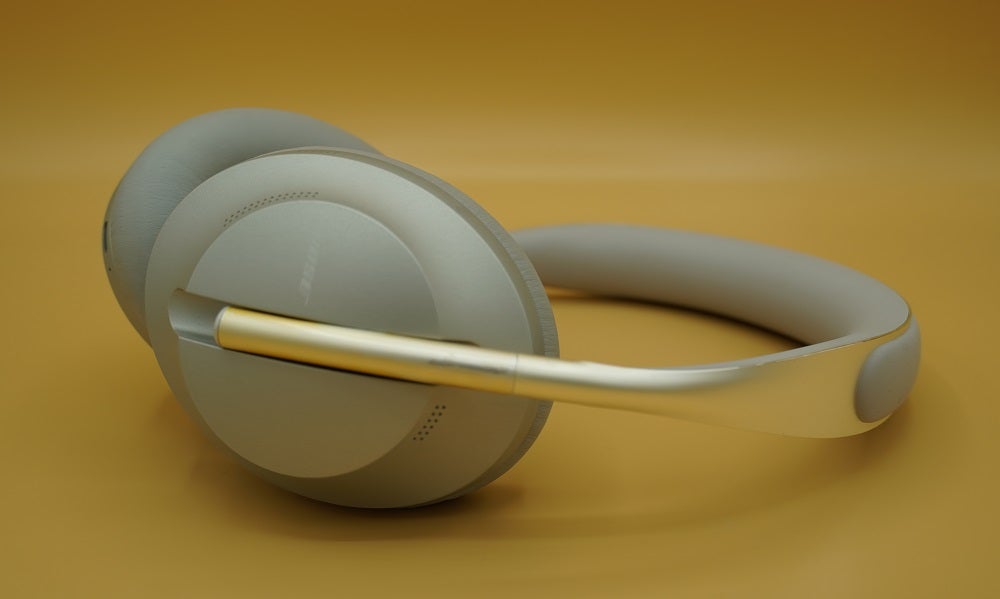 Right side view of a silver-white Bose NC700 headphones
