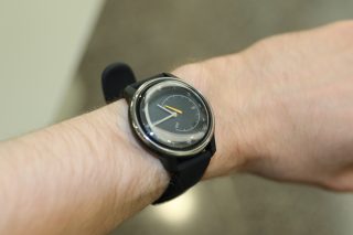 A black Withings Move ECG watch wore on hand