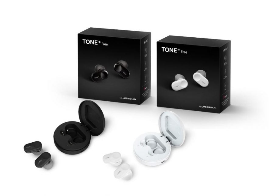 Two different colored LG Tone Plus earbuds kept on white background with their cases and package boxes kept behind