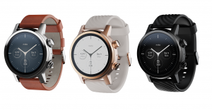 Three different colored Motorola 360 smartwatches standing on white background