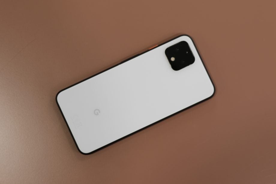 View from top of a Pixel 4 kept on a table facing down, back panel view