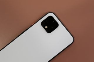 View from top of a Pixel 4 kept on a table facing down, top half back panel view