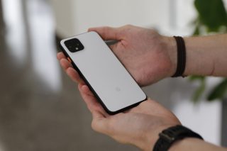 Back panel view of a Pixel 4 held in hand facing back