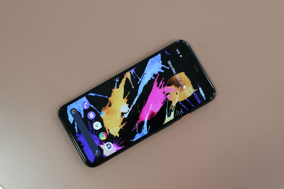 View from top of a Pixel 4 kept on a table displaying homescreen