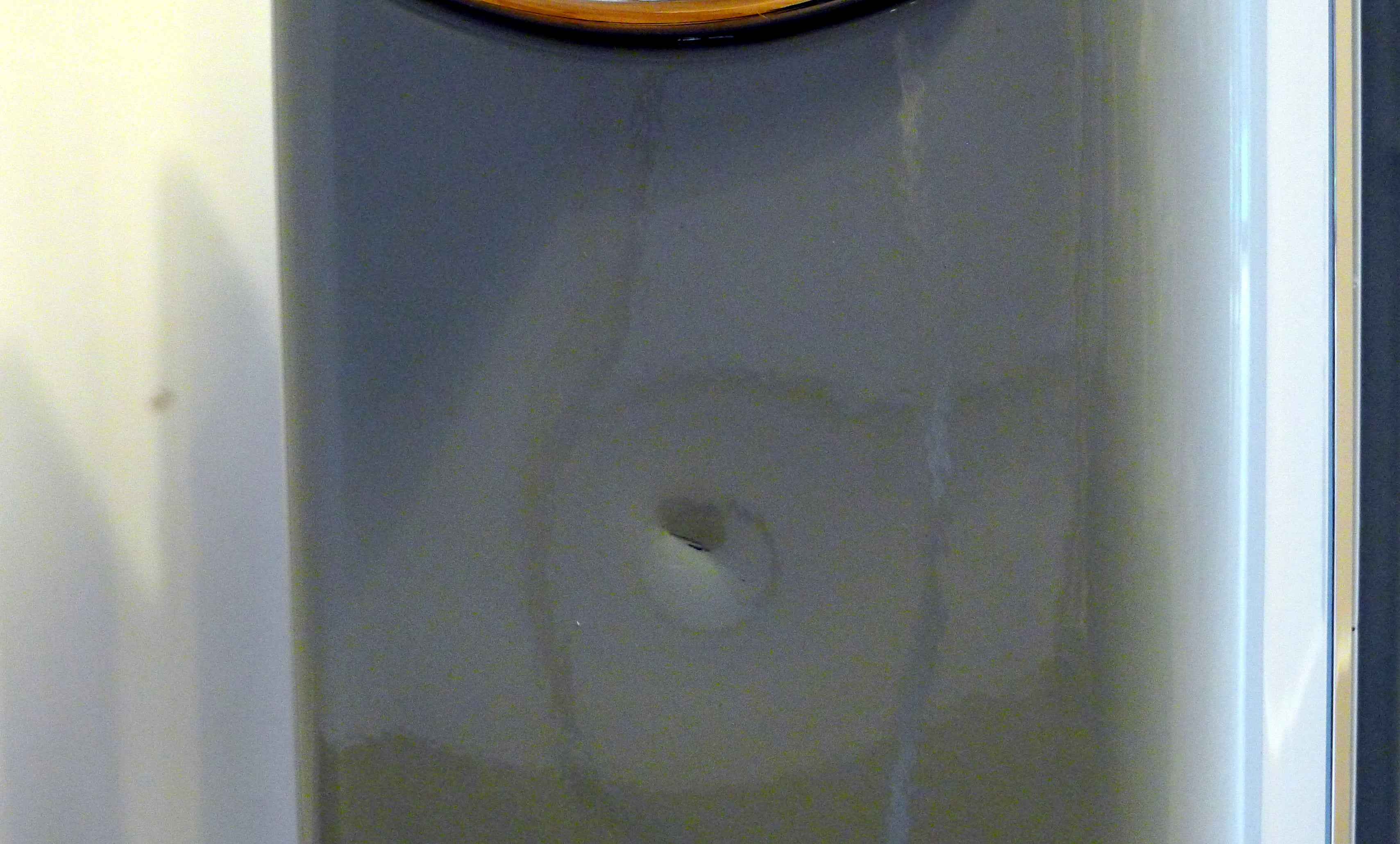 Swan Retro Oil Filled Radiator DentClose up view of a dent on a silver Swan oil-filled radiator