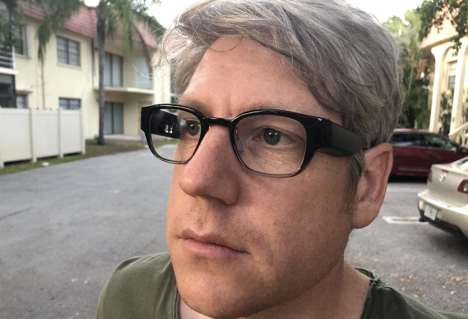 A man wearing black Focals smart glasses