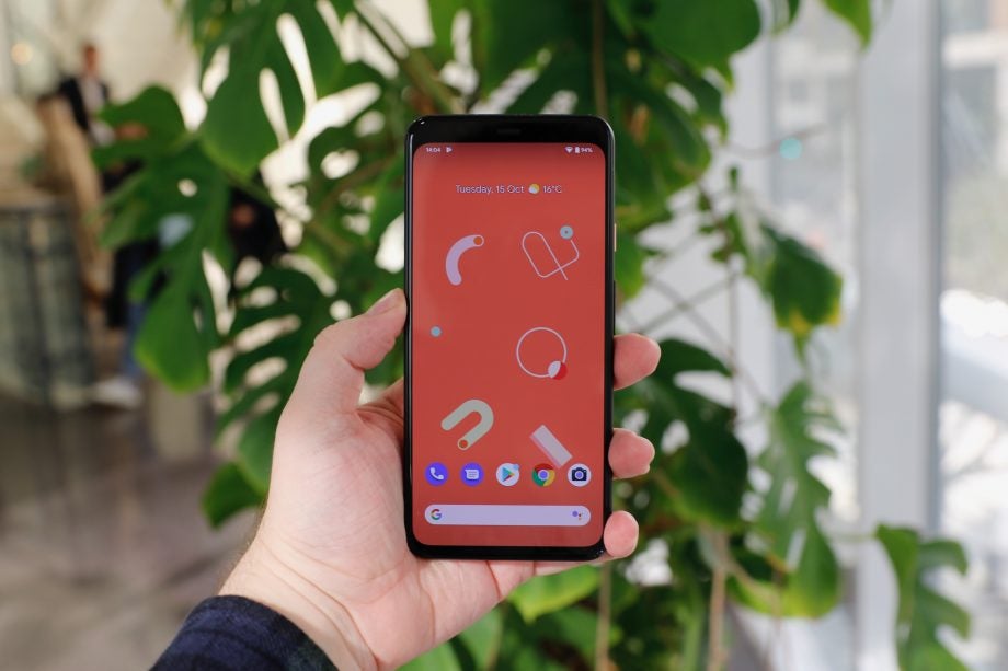 A Google Pixel 4 XL held in hand displaying homescreen