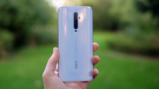 Back panel view of a light blue Oppo Reno 2 Z held in hand facing back