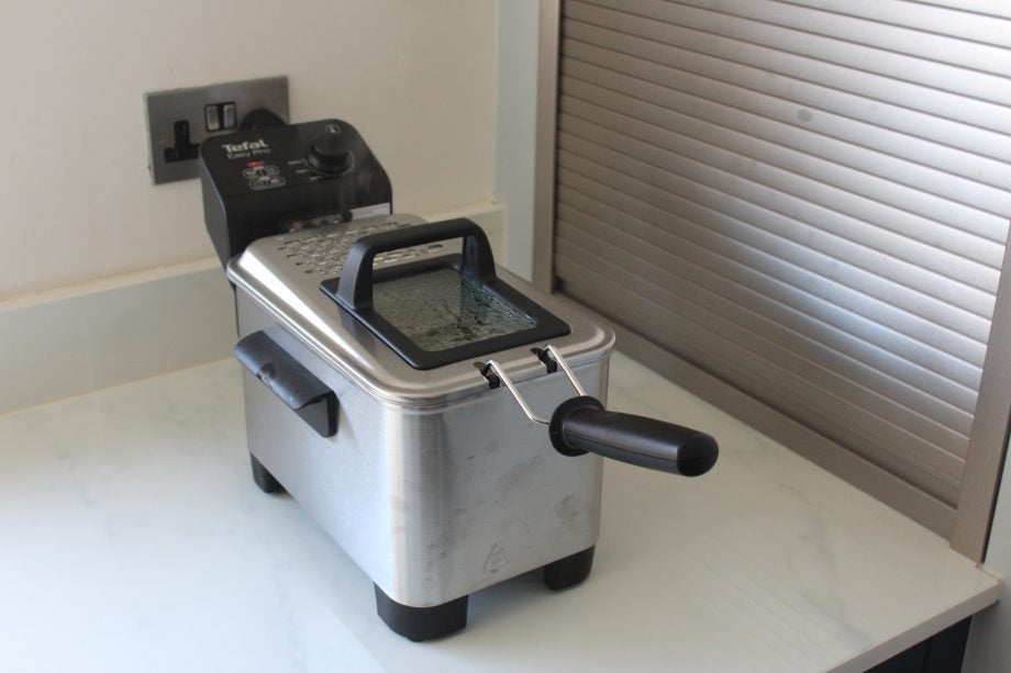 A silver-black Tefal Easy Pro fryer kept on a kitchen platform