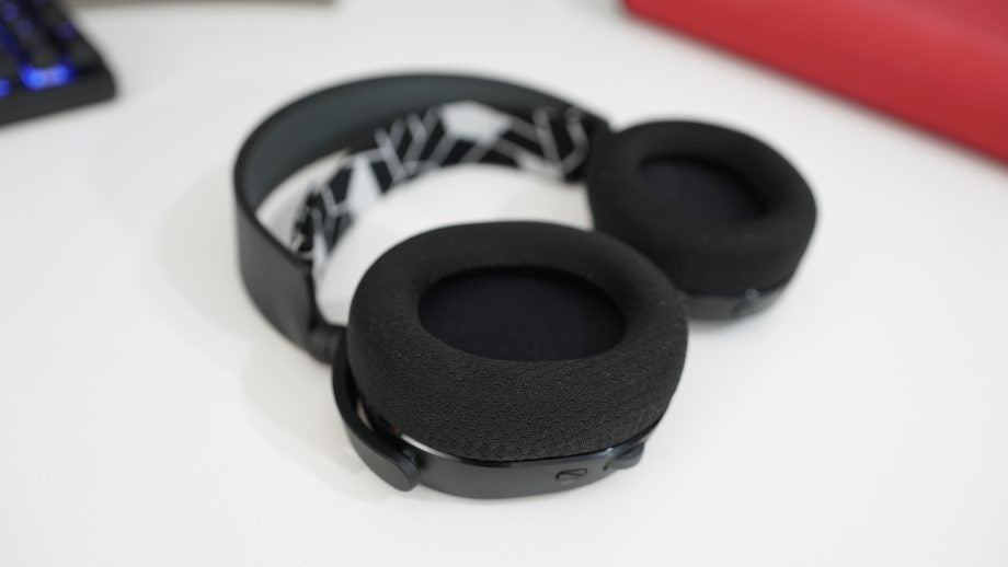Black SteelSeries Arctis 3 headphones kept on a white background, earcups inside view
