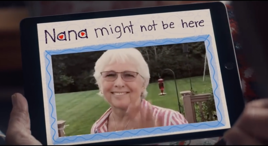 A black tablet held in hand displaying Nana might not be here with a picture of her below