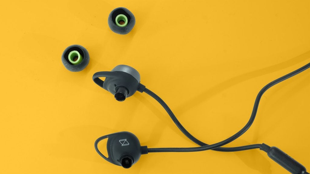 AKG N200NCClose up view of earbuds with their cover removed of AKG N200NC wireless earphones kept on a yellow table
