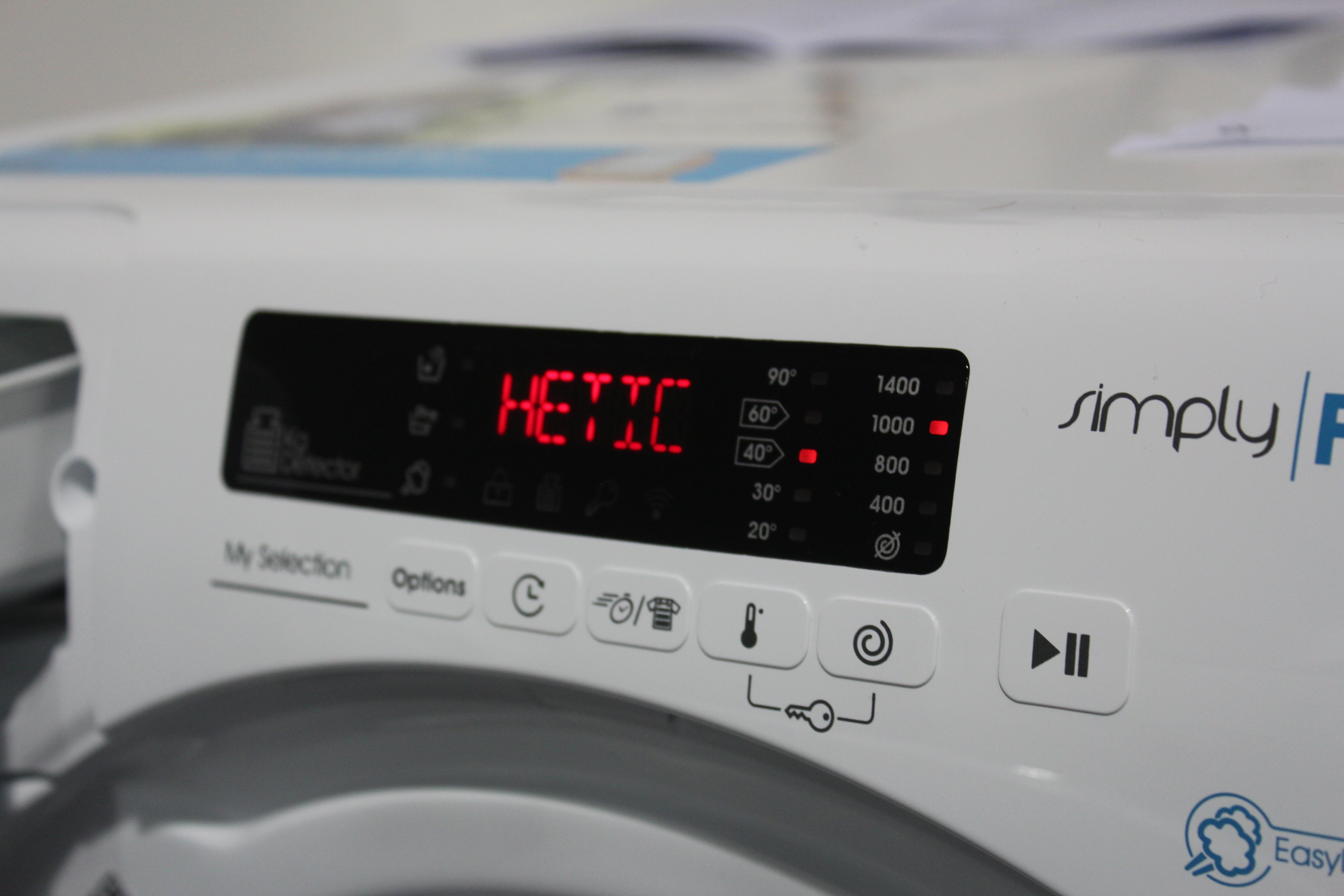 Close up picture of a control panel and mini screen on a white Candy Smart Pro washing machine