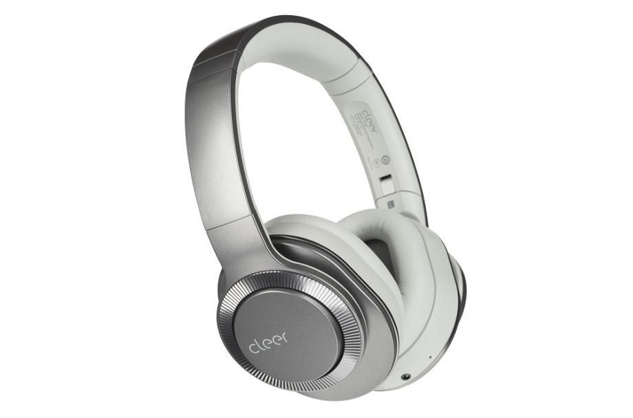 Side view picture of silver-black Cleer Flow II headphones standing on white background