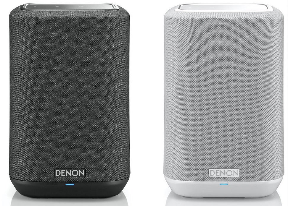 Picture of a black and white Denon Home 150 pair of speakers standing on white background