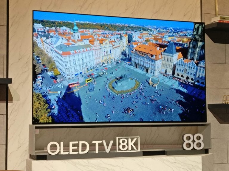 Picture of a black LG OLED 88 8K TV standing on a stand